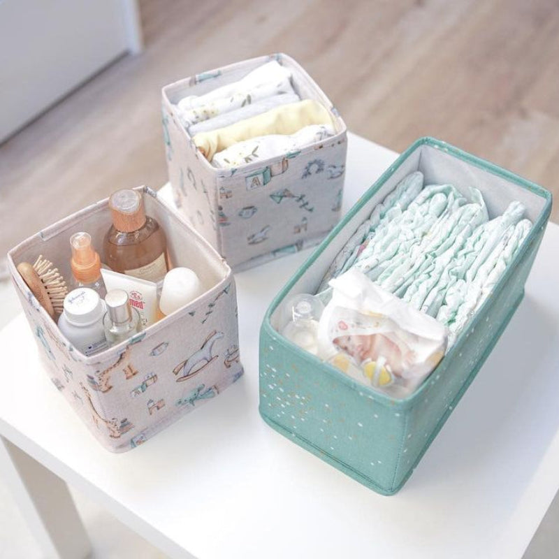 Baby drawer organizer set of 3 with diapers, toys, and bottles
Fabric nursery storage bins in pastel pink with patterns
Drawer organizers for baby clothes, diapers, and essentials
Cute foldable fabric organizers on a wooden table