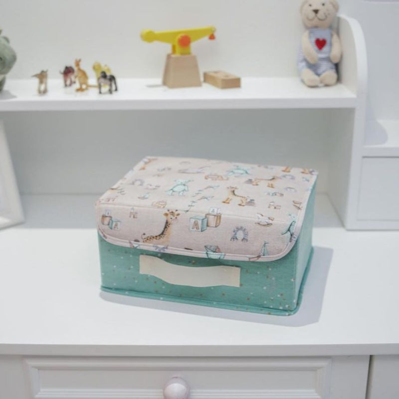 “Mini pink / blue fabric storage box with lid – nursery organizer for baby essentials”
“Small pink / blue storage bin with golden stars and printed playful lid”
“Compact nursery storage box for toys, diapers, and accessories”
“Pink & Blue fabric organizer with handle and illustrated lid design”
“Baby nursery mini storage chest in pink & blue with cute motifs