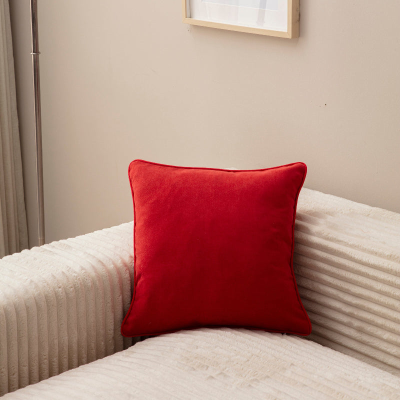 Red velvet square cushion cover 43x43 cm on cream sofa – modern home décor accessory.”