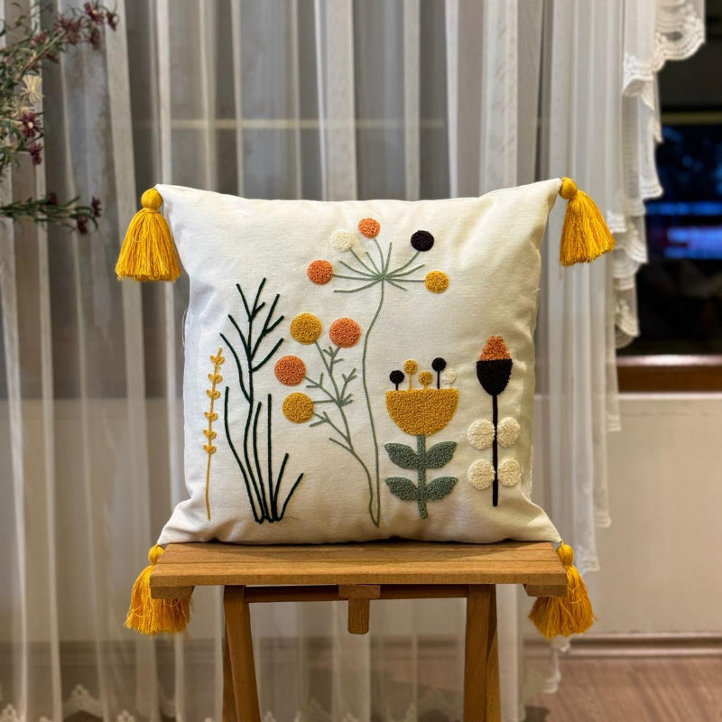 Contempo Floral Collection square embroidered cushion cover with yellow tassels, wildflower motif in mustard, orange, green, and black on white – 43x43 cm decorative pillow