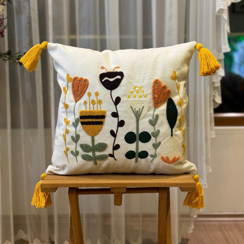 Contempo Floral Collection square embroidered cushion cover with yellow tassels, featuring folk blooms floral embroidery in mustard, orange, green, and black – 43x43 cm decorative pillow