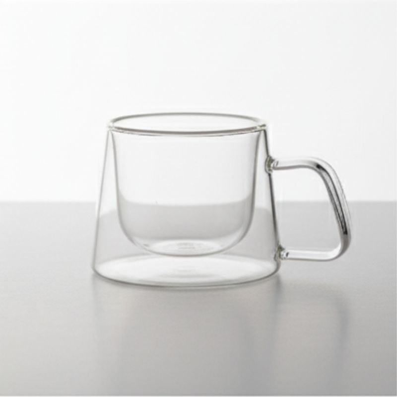 Double-wall glass coffee mug with handle, empty
Heat-resistant clear glass coffee cup for espresso or tea
Modern borosilicate glass mug on white background
Transparent insulated glass mug with ergonomic handle