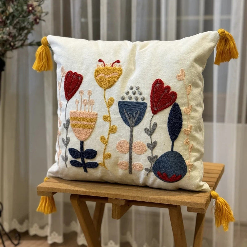 Contempo Floral Collection square embroidered cushion cover with yellow tassels, featuring tulip and heart floral motifs in red, yellow, and blue – 43x43 cm decorative pillow