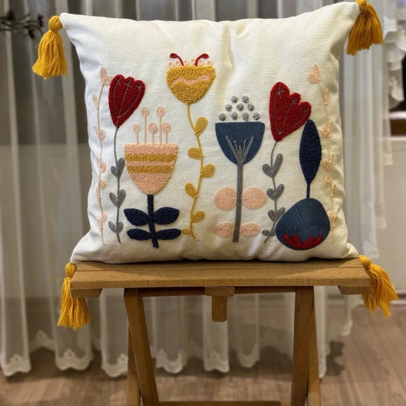 Contempo Floral Collection square embroidered cushion cover with yellow tassels, featuring tulip and heart floral motifs in red, yellow, and blue – 43x43 cm decorative pillow