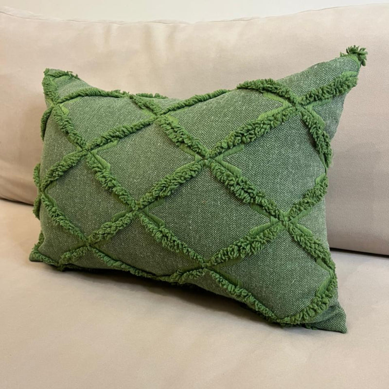 Green textured decorative cushion cover with raised diamond pattern on beige sofa