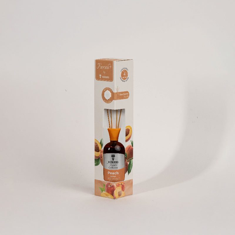 Elegant glass Peach reed diffuser with fragrance oil and natural sticks for home fragrance