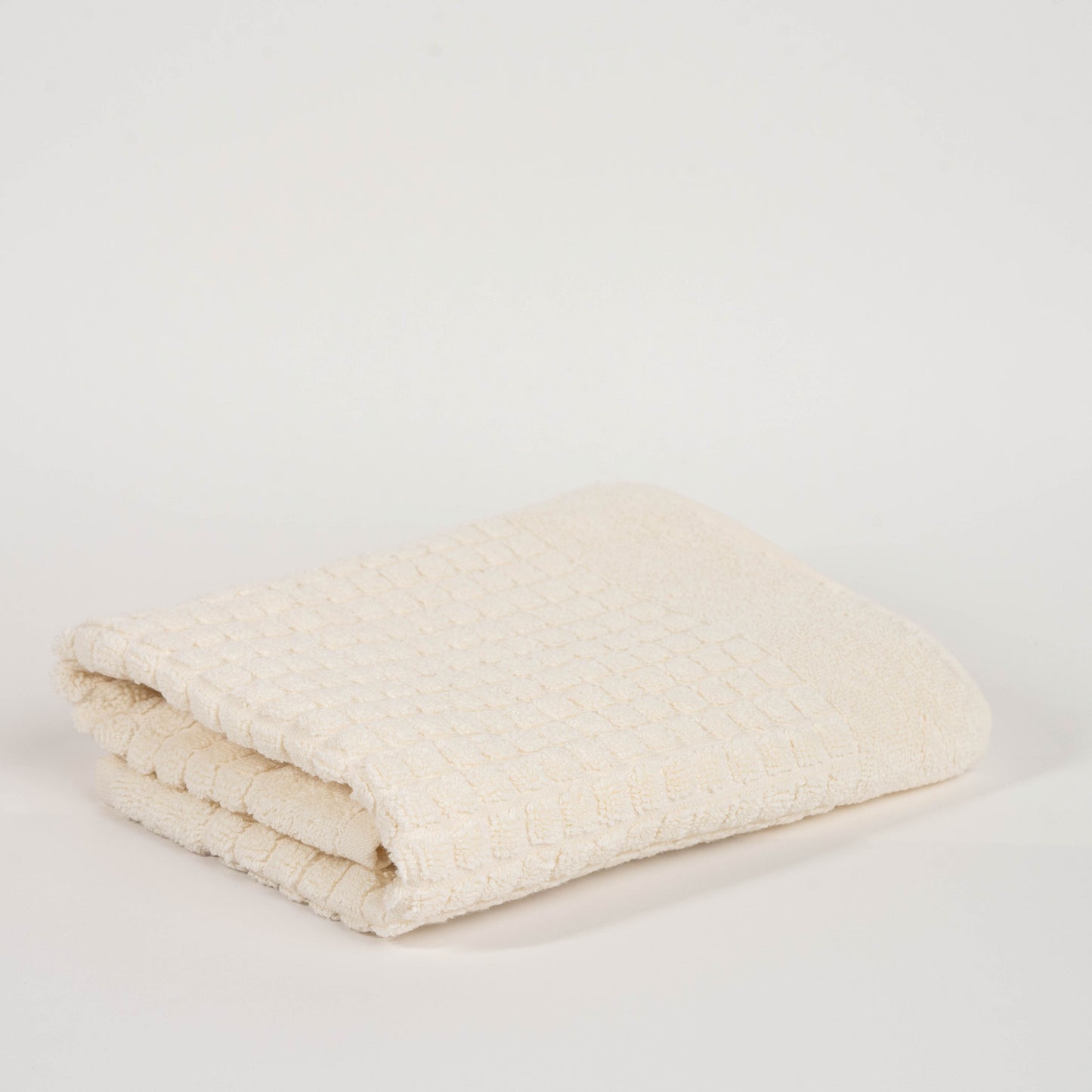 Absorbent hotel-style cream bathroom rug