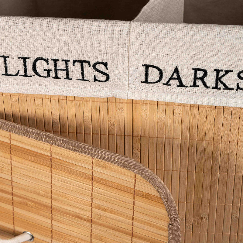 bamboo-laundry-hamper-dual-compartments-lights-darks.jpg – Bamboo laundry hamper with lid and two compartments labeled Lights and Darks.