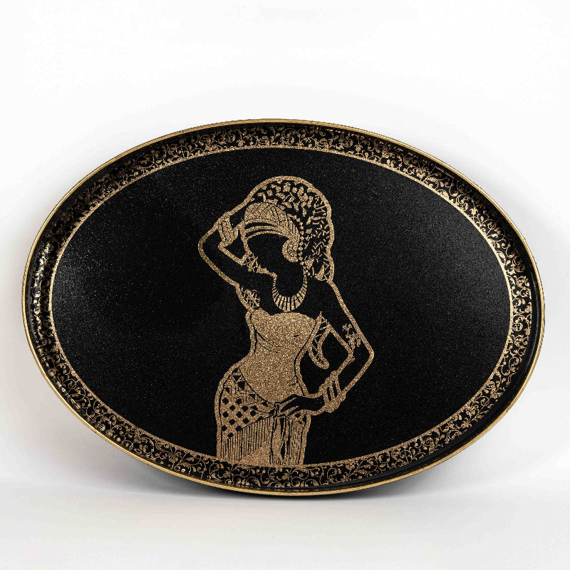 Oval black tray with golden African woman silhouette design
Artistic decorative tray with black and gold pattern
Elegant serving tray with African-inspired art
Black and gold oval tray for coffee table or wall décor