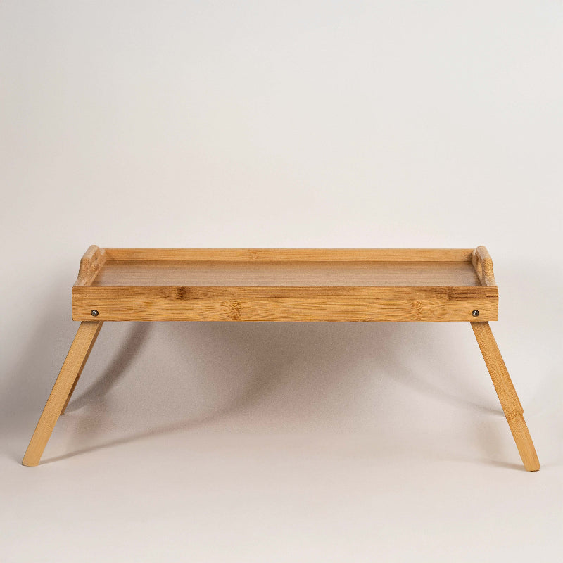 Foldable bamboo bed tray table with raised edges
Breakfast in bed tray made from natural bamboo
Eco-friendly bamboo laptop stand with foldable legs
Wooden serving tray table for bed or sofa use