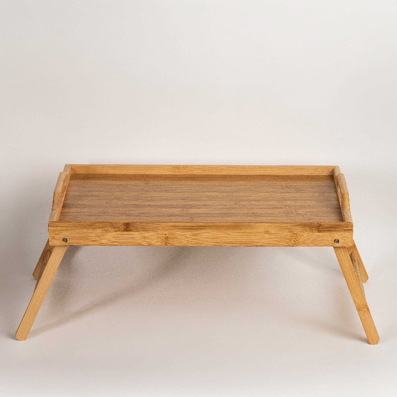 Foldable bamboo bed tray table with raised edges
Breakfast in bed tray made from natural bamboo
Eco-friendly bamboo laptop stand with foldable legs
Wooden serving tray table for bed or sofa use