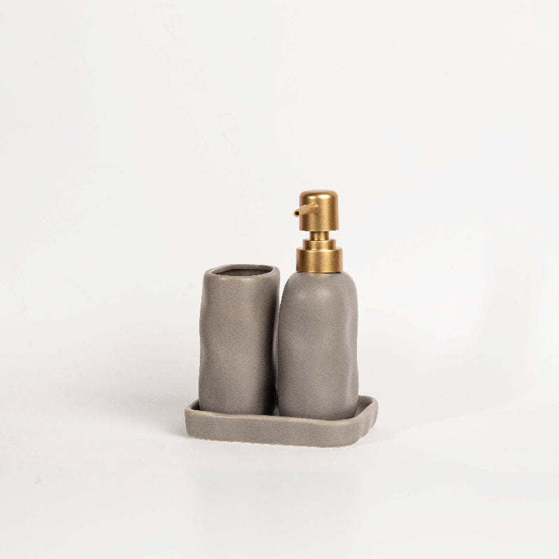 Luxury stone-effect soap dispenser and tumbler set with tray by the poolside