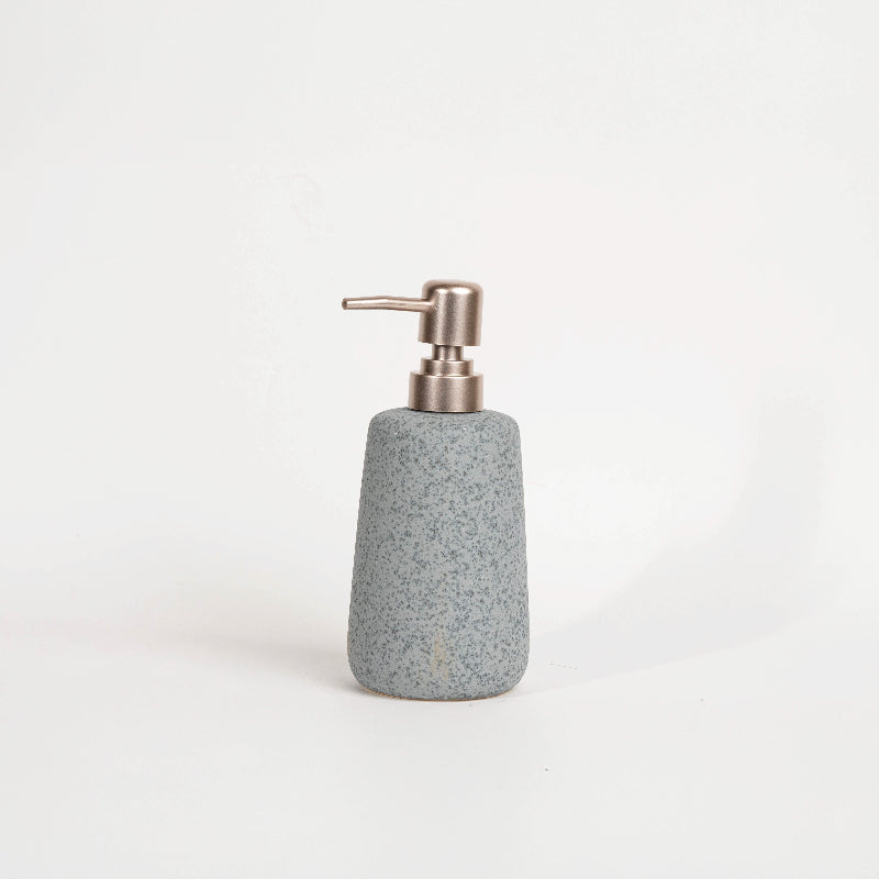 Stone-effect soap dispenser with modern pump for bathroom or kitchen
