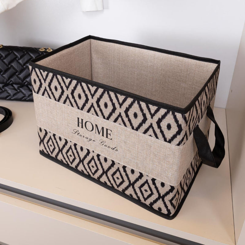 Rectangular boho storage basket with black and beige tribal design
Fabric storage bin with side handles – laundry and toy organizer
Modern home storage basket with “HOME Storage Goods” text
Foldable rectangular organizer for shelves and closets