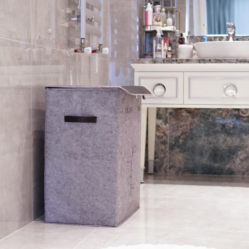 Dual-compartment laundry basket with lid for lights and darks
Felt laundry basket with two sections and black lid
Modern clothes sorter with handles and lid cover
Foldable 2-section laundry hamper for home organization