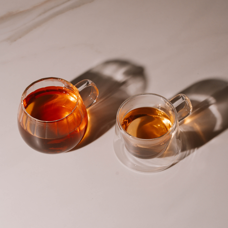 Double-wall glass coffee mug with handle, empty
Heat-resistant clear glass coffee cup for espresso or tea
Modern borosilicate glass mug on white background
Transparent insulated glass mug with ergonomic handle