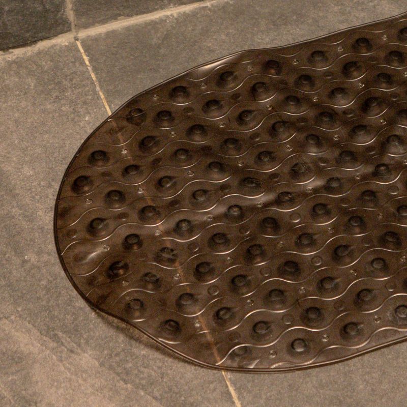 Dark brown anti-slip capsule rubber shower mat on gray tiled bathroom floor