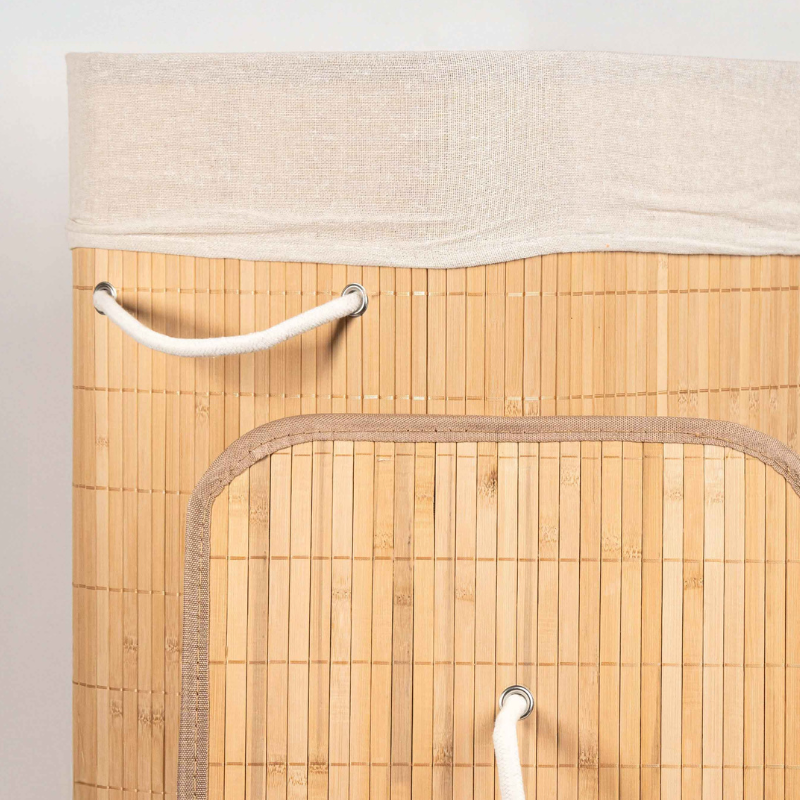Round bamboo laundry basket with lid and off-white fabric lining.