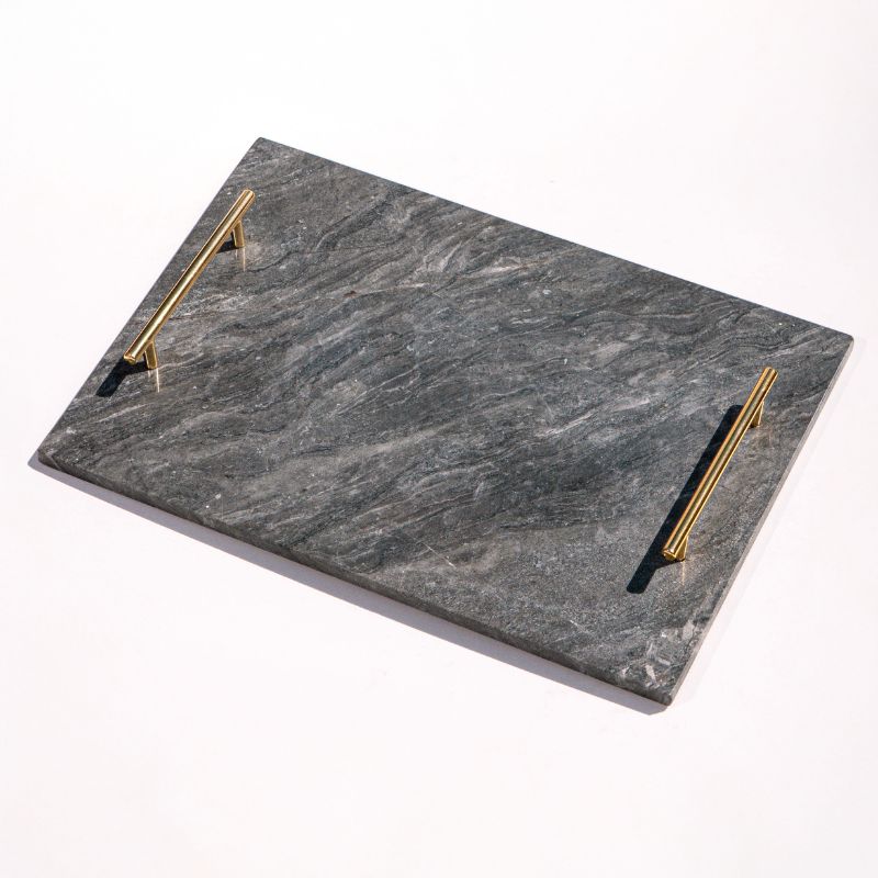 slate marble tray with brass handles placed poolside – luxury stone serving tray