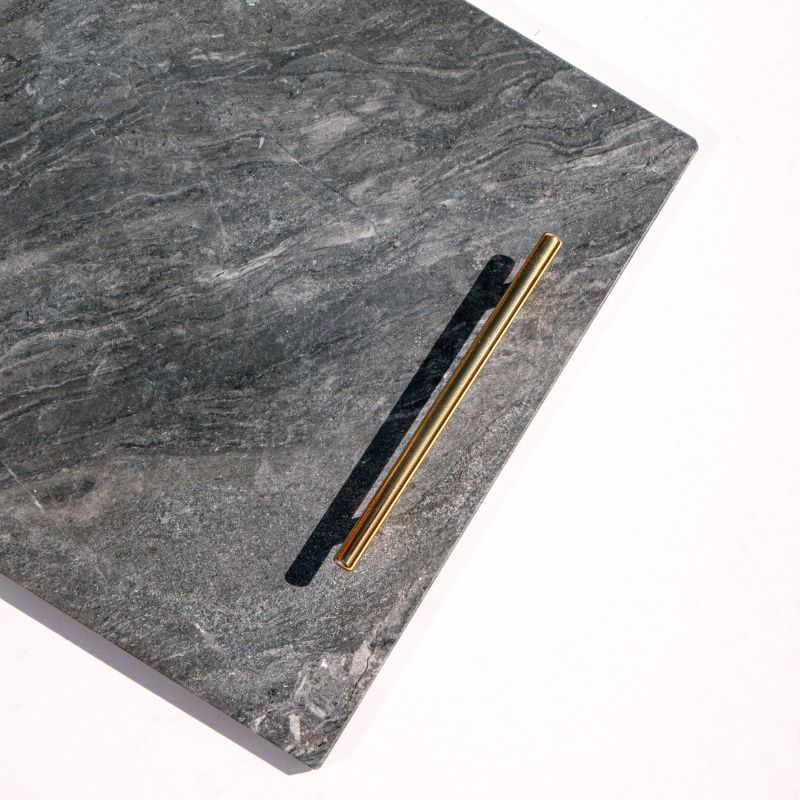 slate marble tray with brass handles placed poolside – luxury stone serving tray