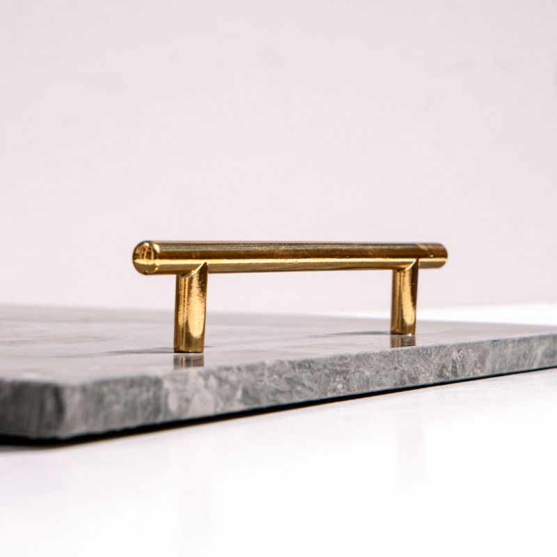 slate marble tray with brass handles placed poolside – luxury stone serving tray