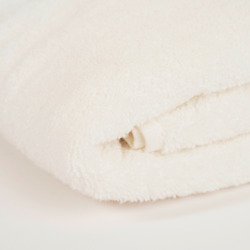 Main Bundle Image: “White bathroom essentials bundle with bamboo laundry basket, pure white towels, white bath mat, and transparent anti-slip mat.”