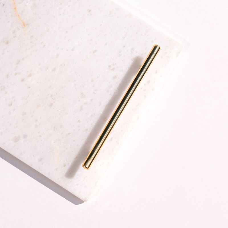 white marble tray with brass handles next to pool – luxury serving tray