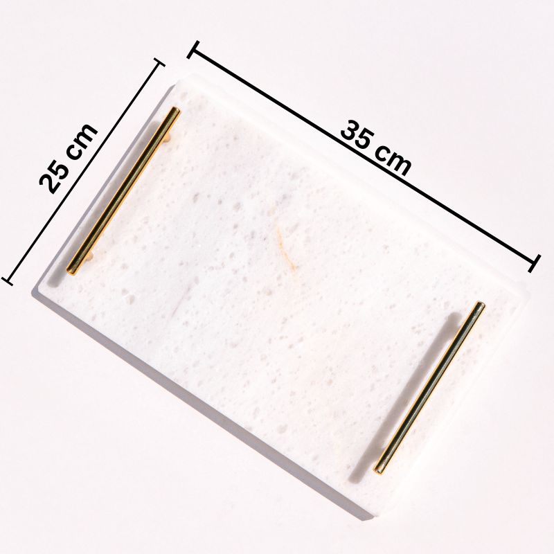 white marble tray with brass handles next to pool – luxury serving tray