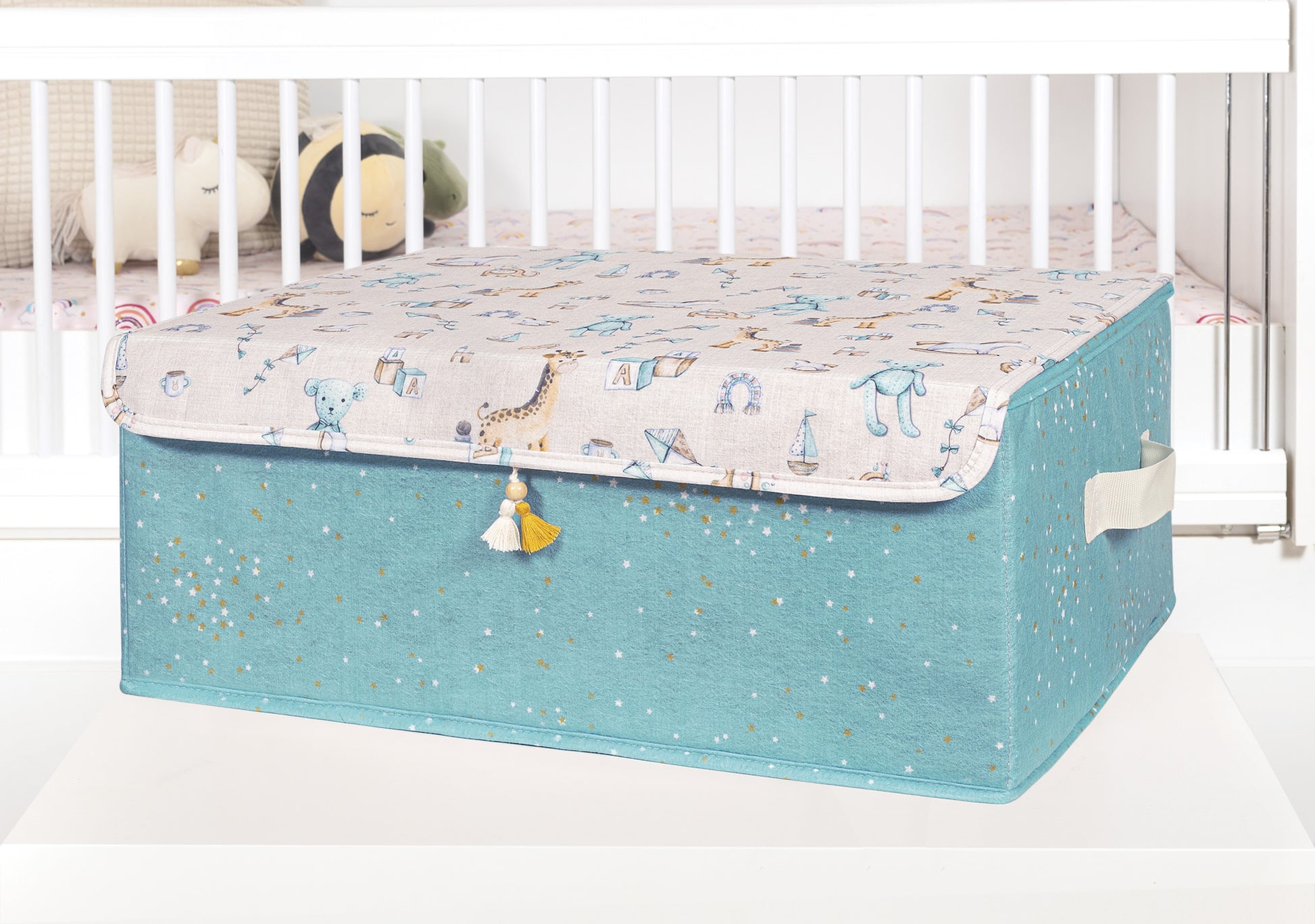 Blue baby storage box with lid featuring gold star pattern and nursery illustrations, decorative organizer with side handles for baby clothes and toys.