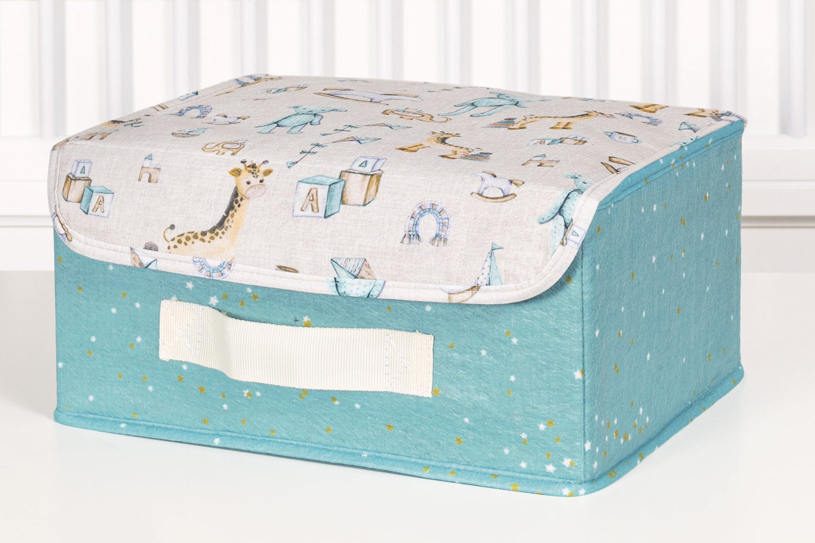 “Mini pink / blue fabric storage box with lid – nursery organizer for baby essentials”
“Small pink / blue storage bin with golden stars and printed playful lid”
“Compact nursery storage box for toys, diapers, and accessories”
“Pink & Blue fabric organizer with handle and illustrated lid design”
“Baby nursery mini storage chest in pink & blue with cute motifs