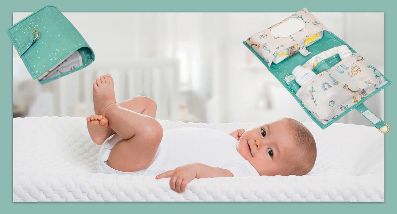 Foldable baby changing mat with built-in storage pockets and diapers, shown above a baby lying on a soft mat