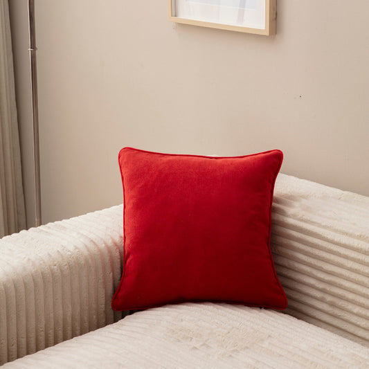 Red velvet square cushion cover 43x43 cm on cream sofa – modern home décor accessory.”