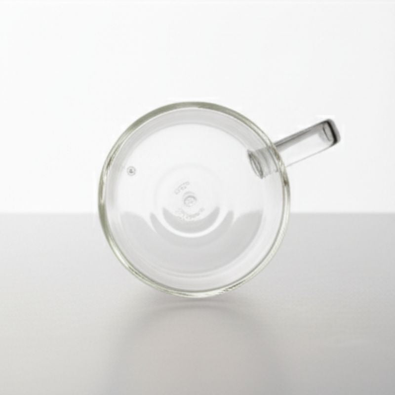 Double-wall glass coffee mug with handle, empty
Heat-resistant clear glass coffee cup for espresso or tea
Modern borosilicate glass mug on white background
Transparent insulated glass mug with ergonomic handle