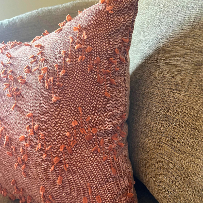 Polka Zigzag Collection – 43x43 cm Warm Terracotta embroidered cushion cover on beige sofa