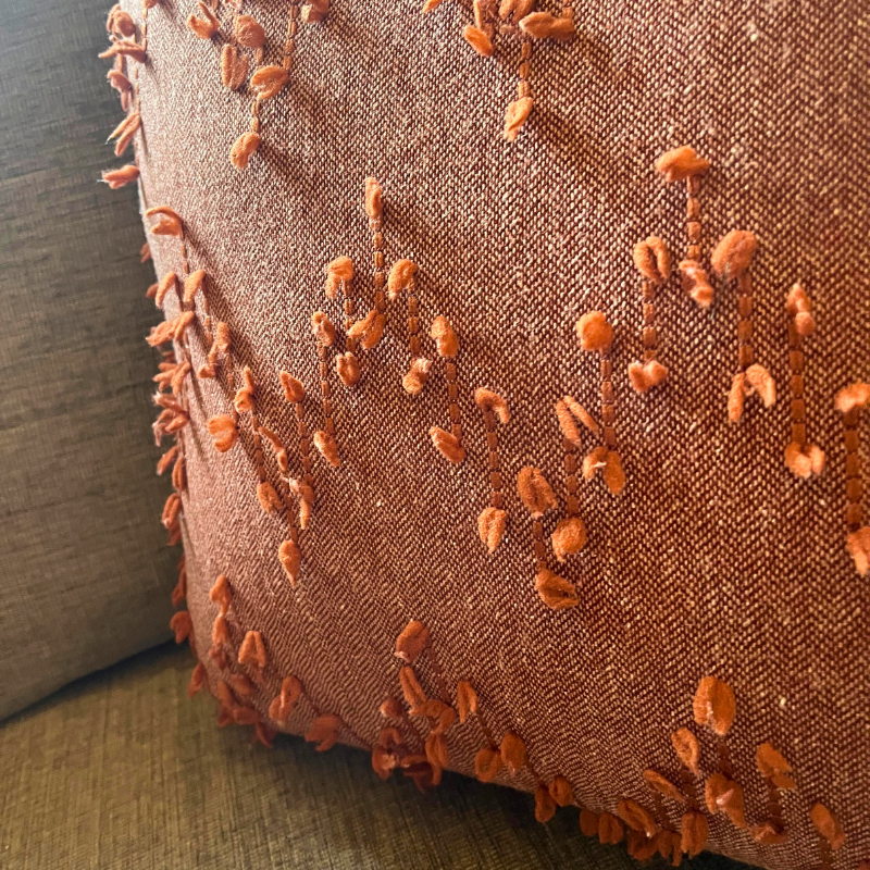 Polka Zigzag Collection – 43x43 cm Warm Terracotta embroidered cushion cover on beige sofa