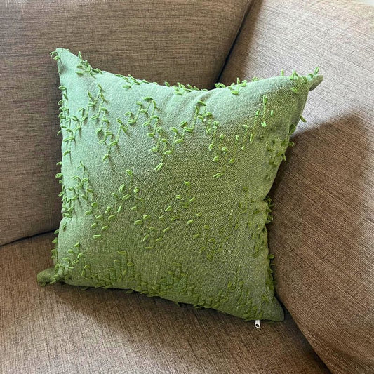 Polka Zigzag Collection – 43x43 cm leafy green embroidered cushion cover on beige sofa