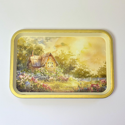 Rectangular serving tray with countryside cottage garden illustration and gold-toned border