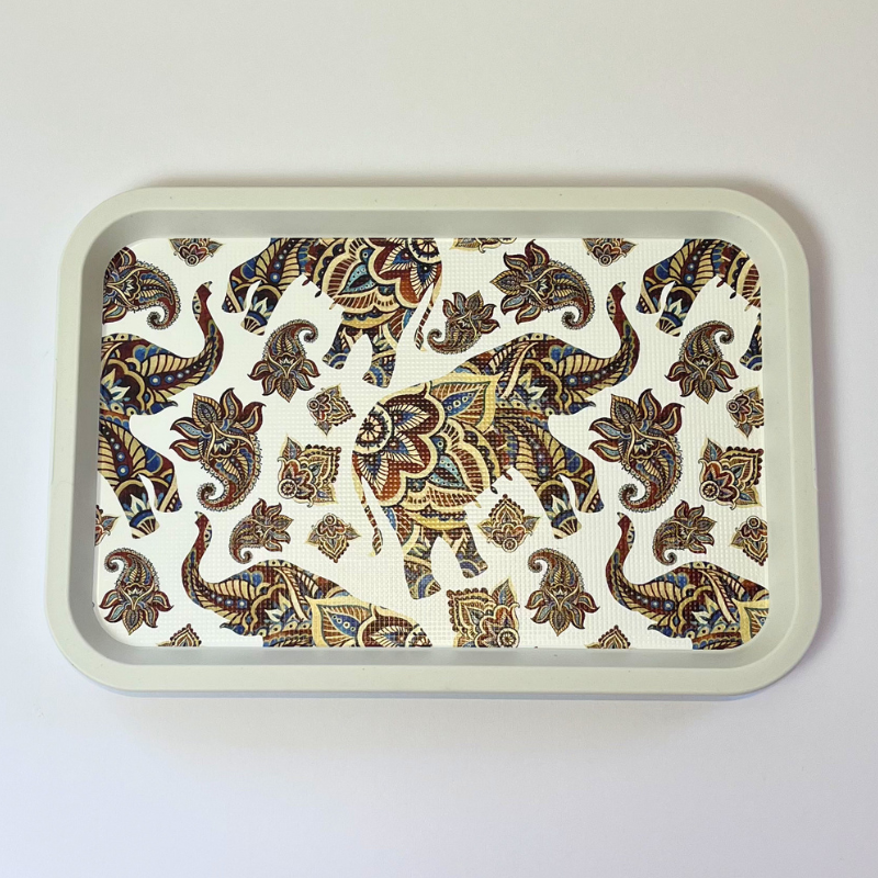 Rectangular serving tray with elephant and paisley-inspired pattern on a light background