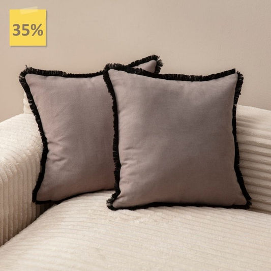 Taupe cushion cover with black fringe on sofa – 43x43 cm
Pair of taupe and black fringe cushions styled for modern décor
Close-up of taupe cushion with bold black trim edges
Decorative pillow in taupe with black fringe for living room décor