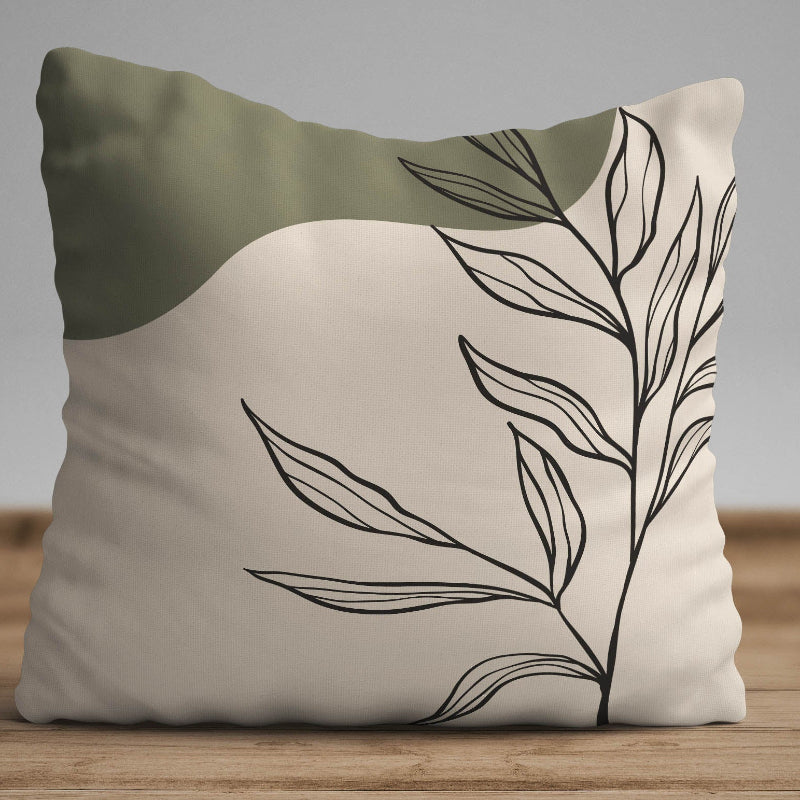 Minimalist botanical cushion cover with black leaf line art on beige fabric with olive green accent
