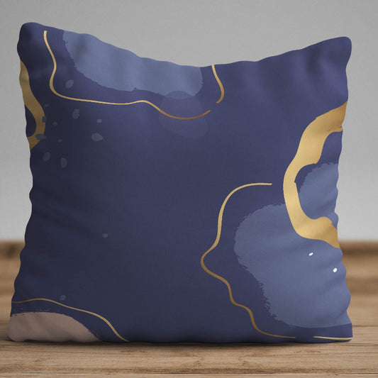 Navy blue cushion cover with gold abstract lines and soft artistic textures on a modern decorative pillow