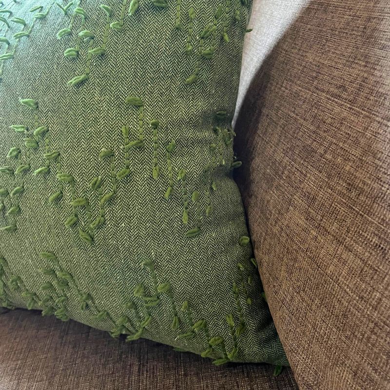 Polka Zigzag Collection – 43x43 cm leafy green embroidered cushion cover on beige sofa