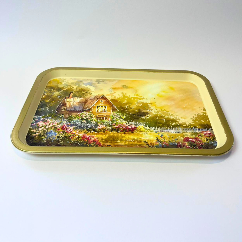 Rectangular serving tray with countryside cottage garden illustration and gold-toned border
