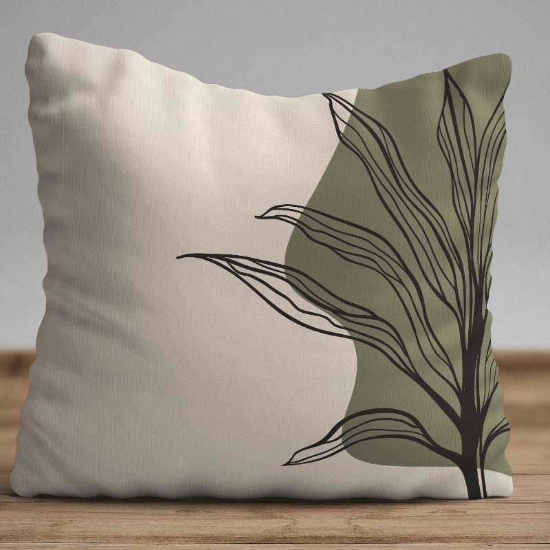 Minimalist cushion cover with black leaf line art on beige background with olive abstract shape