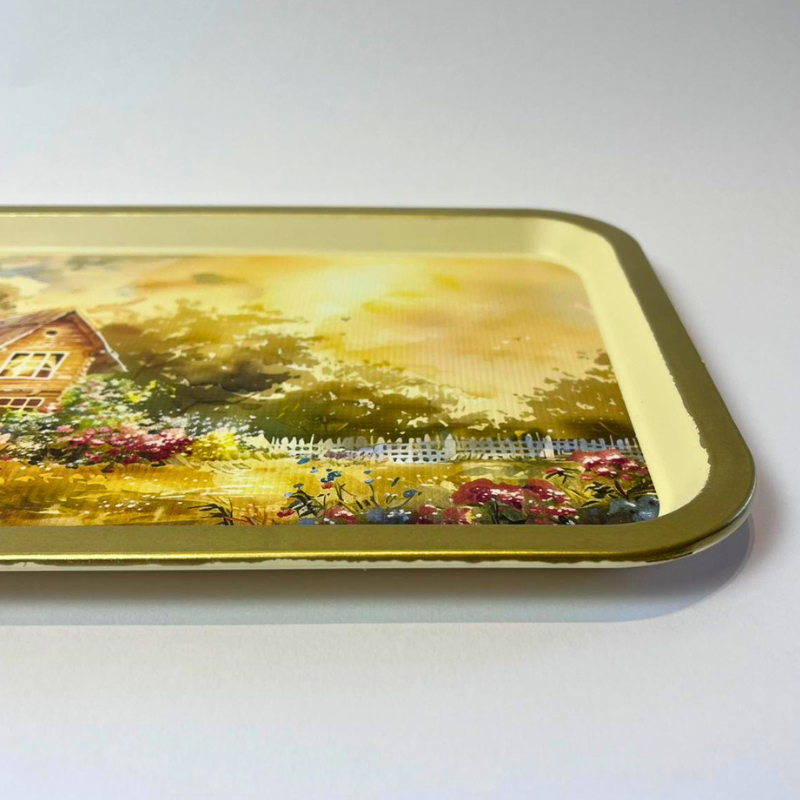 Rectangular serving tray with countryside cottage garden illustration and gold-toned border