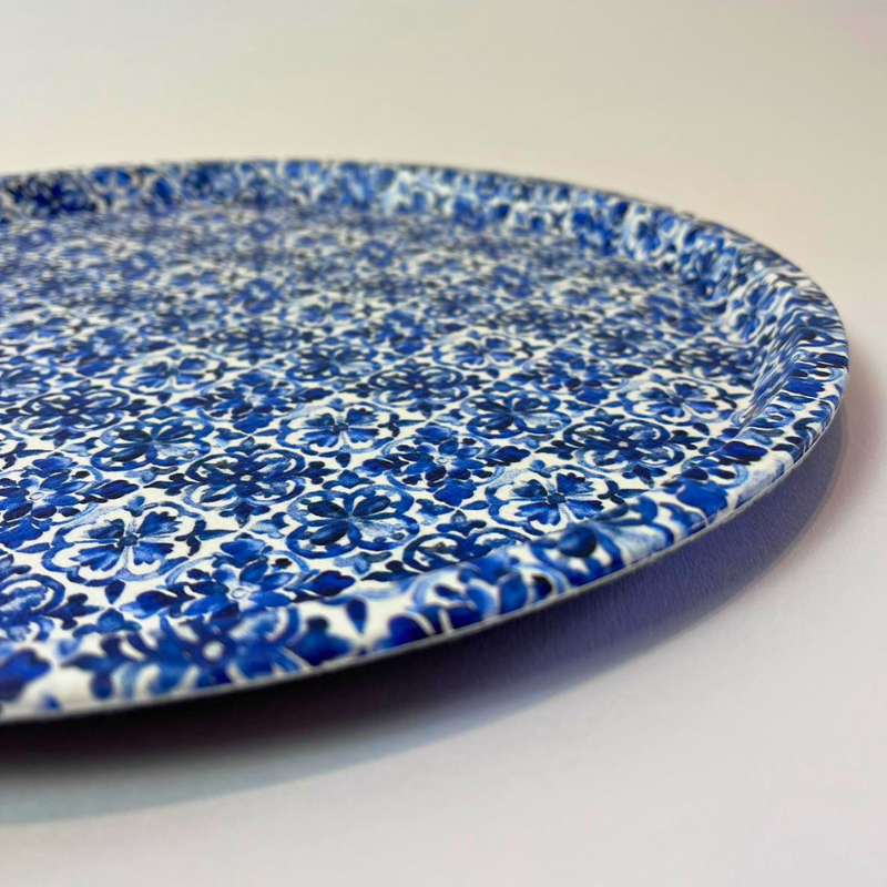 Blue and white floral patterned plate on a white background