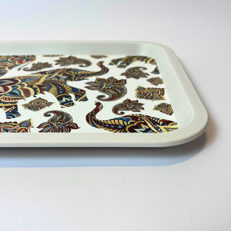 Rectangular serving tray with elephant and paisley-inspired pattern on a light background