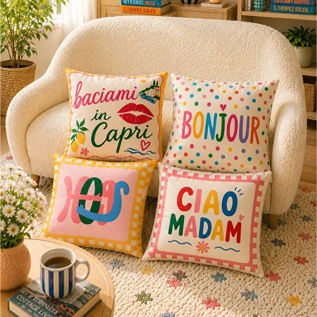 Set of four elegant blush pink decorative cushion covers featuring blooming lily bouquets, vintage tea set illustrations, striped ceramic vases, and soft pastel patterns displayed on a cozy cream sofa.