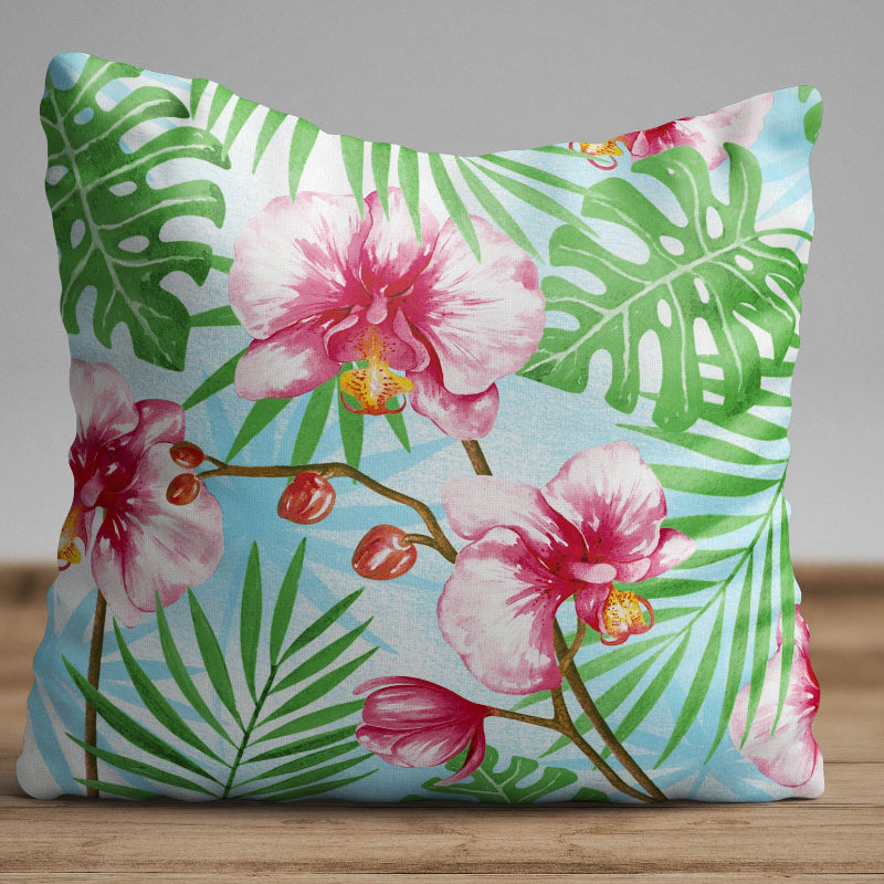 Tropical orchid cushion cover with pink flowers and green leaves on blue background decorative pillow