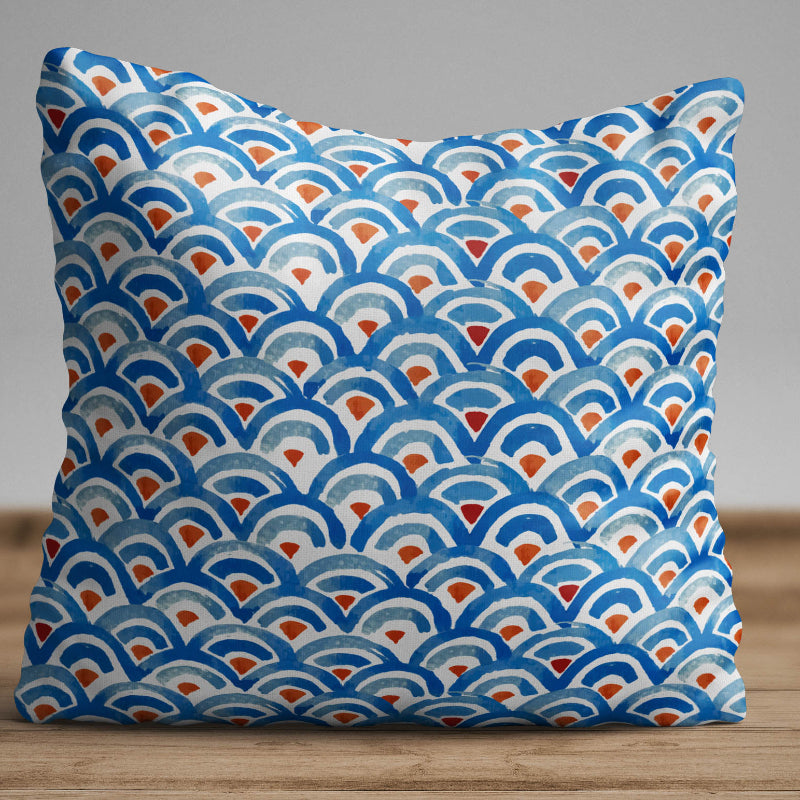 Blue geometric wave pattern cushion cover with repeating ocean-inspired design on decorative pillow